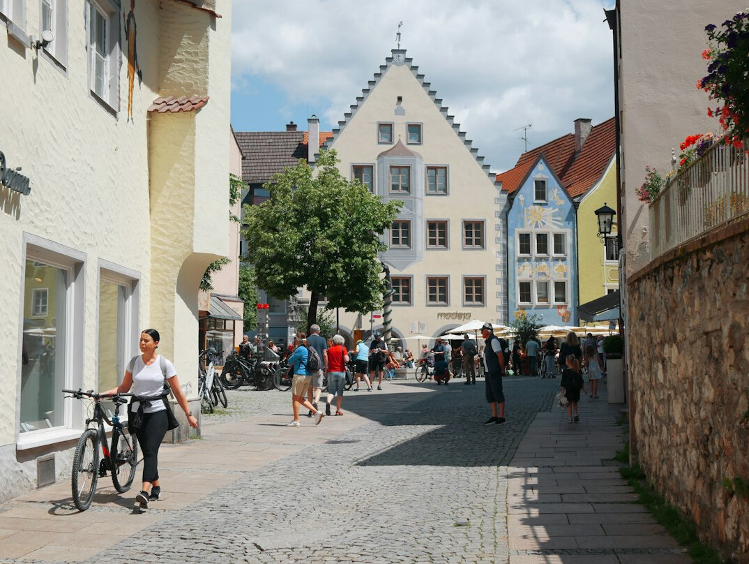 Historic city street facade with pedestrians walking